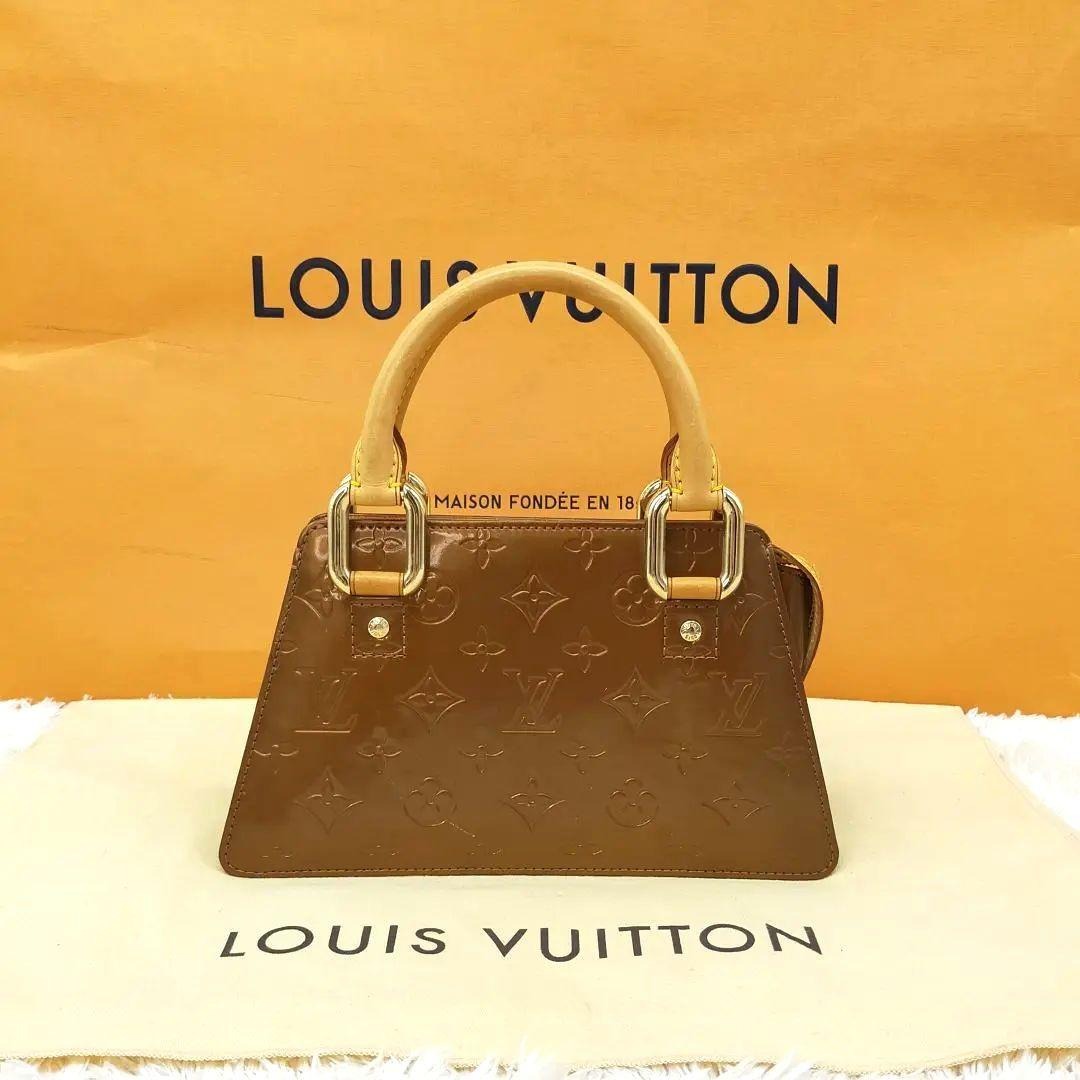 Sold at Auction: Louis Vuitton, LOUIS VUITTON FORSYTH MINI BRONZE VERNIS  HANDBAG