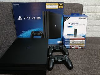Ps4 pro 1TB 7218b  model 2 controllers and games