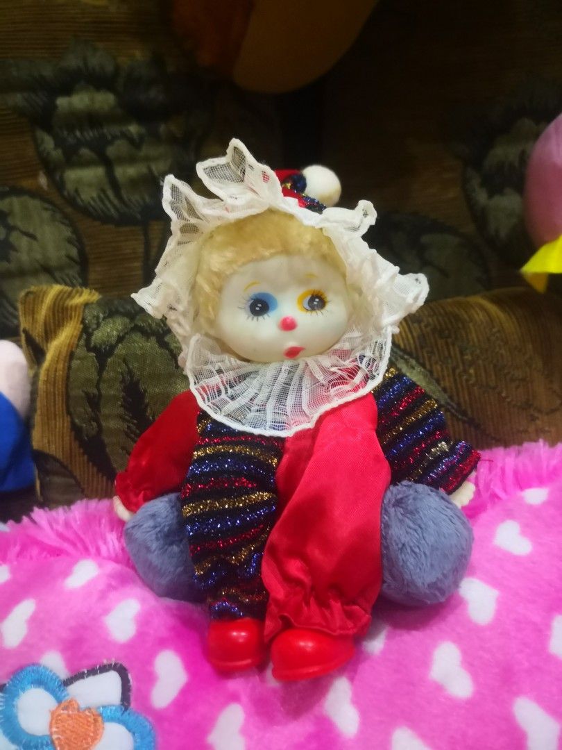 Baby deals clown doll