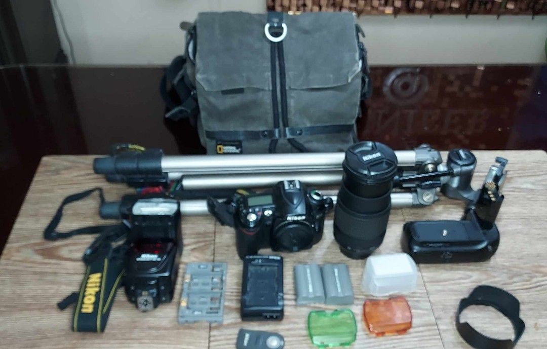 Nikon D90 with accessories (Category: Cameras) located in Paranaque City. Submitted by jenneh31 (Listing ID 1253450765, Image 2). Description: Nikon D90 Main Body: -DSLRS with an HD movie mode -Resolution 12 megapixels -DX-Format CMOS imaging sensor - ISO Auto, 200 - 3200 Accesories: - Nikon SB-700 Speedlight Flash - Nikon MB-D18 Multi-Power Batery Pack - Nikon AF-S DX Nikkor 18-140mm f/3.5-5.6G ED VR lens - Tripad - National Geographic camera ba