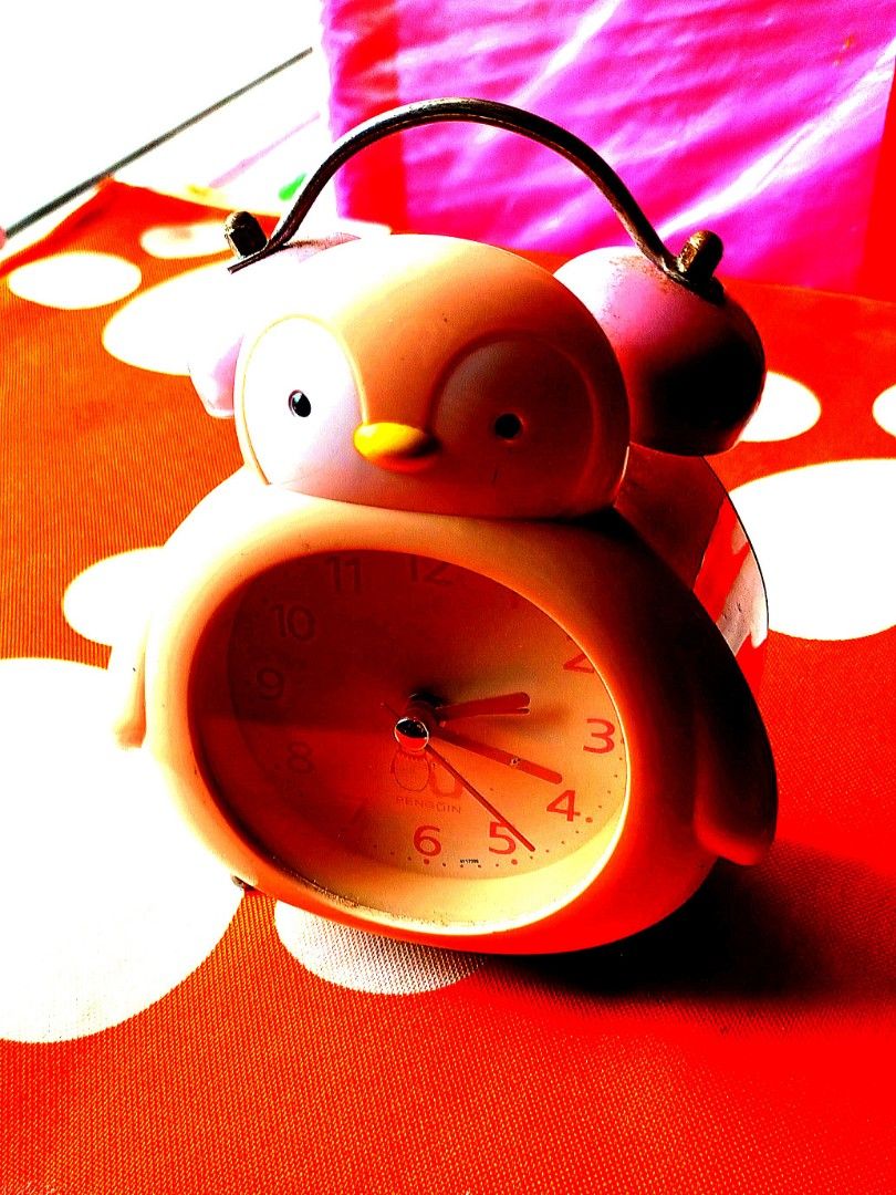 Pink Penguin Clock still functions well to check on time but alarm