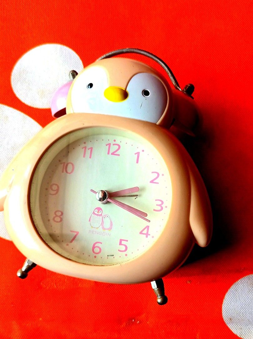 Pink Penguin Clock still functions well to check on time but alarm