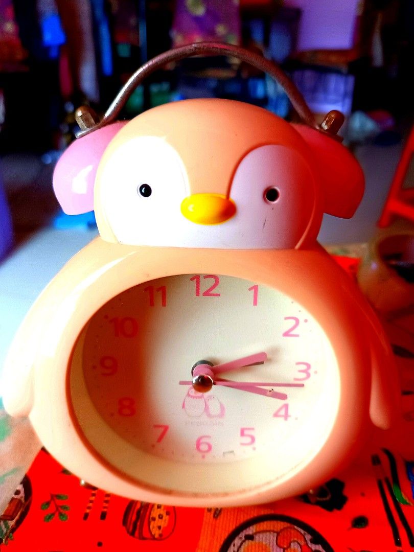 Pink Penguin Clock still functions well to check on time but alarm