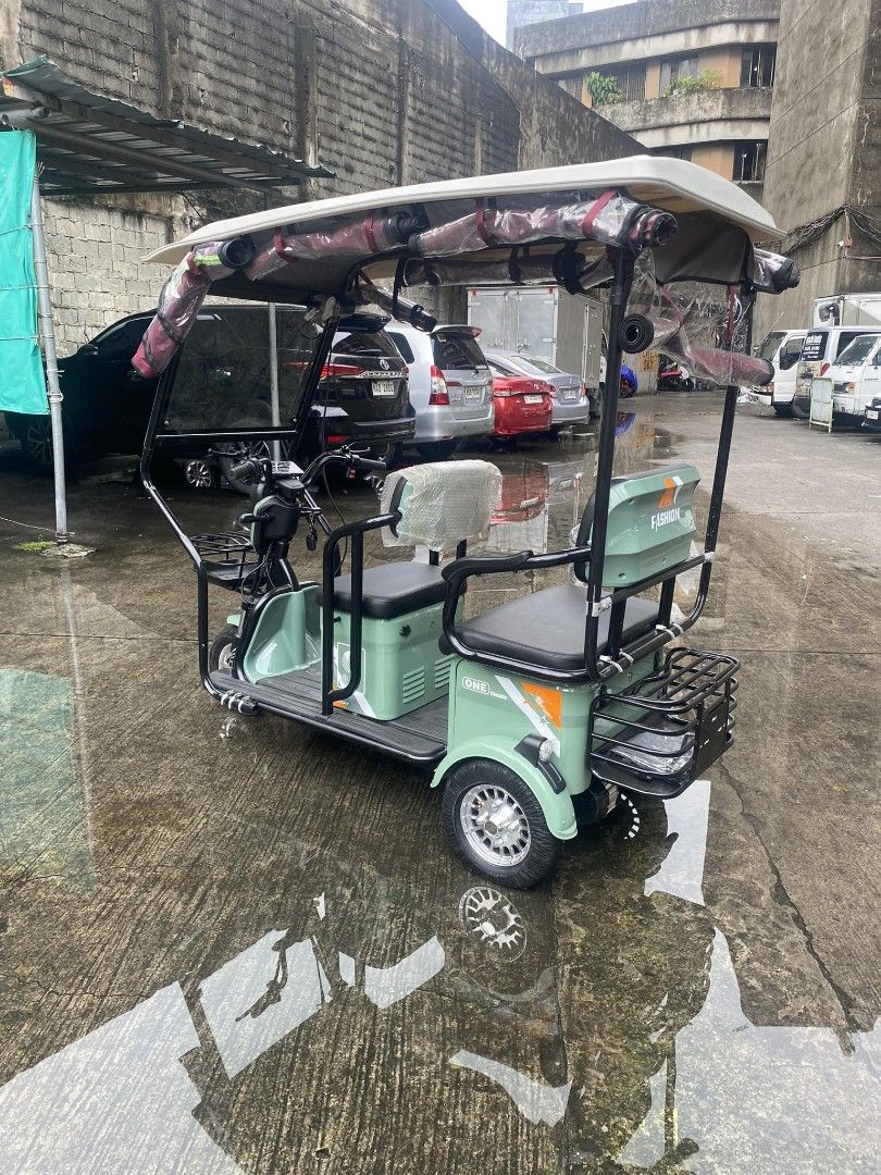 Super fashion ebike 3 wheels (Category: Bicycles) located in Manila. Submitted by minidivisoria (Listing ID 1257021030, Image 2). Description: For sale🔥 NEW ARRIVAL‼️ Super FASHION ebike 3 wheels,2 rows with ROOF! INCLUSIONS: Unit with complete accessories Side mirror with trapal automatic wiper Colors avail Red Black in Glossy Violet Gray Blue Specs. With wiper With panel With anti theft alarm 3 seater Front & Back Basket Battery Lead Acid 48v 