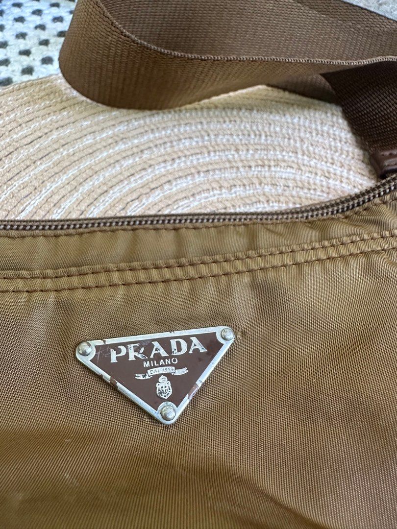 Auth Prada Slingbag with Free organizer (Category: Luxury Bags & Wallets) located in Manila. Submitted by heyqueeney (Listing ID 1257206073, Image 2). Description: Guaranteed Authentic Prada Nylon Sling Bag Unisex with FREE organizer Php5450 selling price Location is Taguig po In good working condition Color of the bag mag vary due to lighting This is used condition so please manage your expectation.