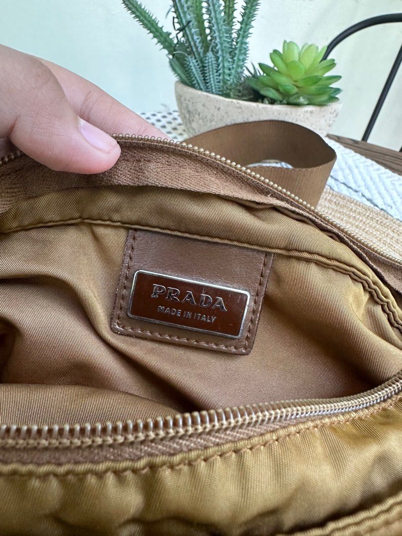 Auth Prada Slingbag with Free organizer (Category: Luxury Bags & Wallets) located in Manila. Submitted by heyqueeney (Listing ID 1257206073, Image 3). Description: Guaranteed Authentic Prada Nylon Sling Bag Unisex with FREE organizer Php5450 selling price Location is Taguig po In good working condition Color of the bag mag vary due to lighting This is used condition so please manage your expectation.