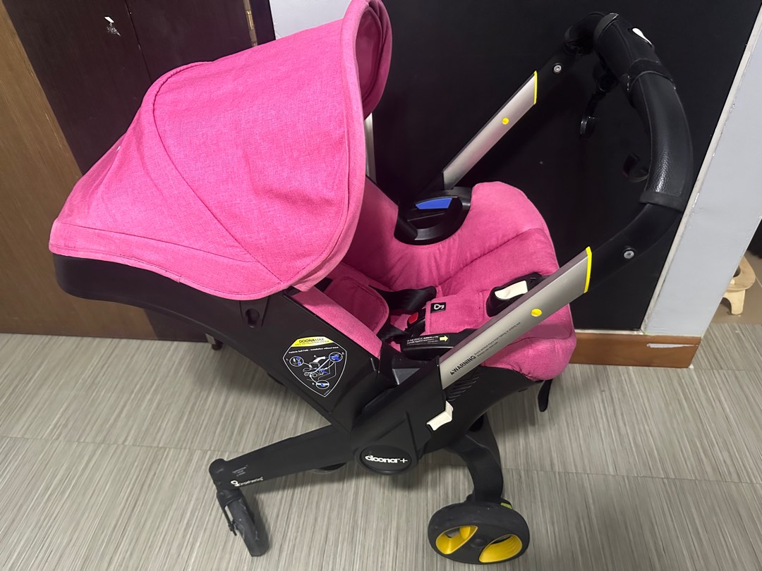 Pink Doona Stroller and Infant Carseat Babies Kids Going Out