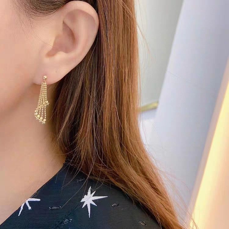 Dangling earrings gold top