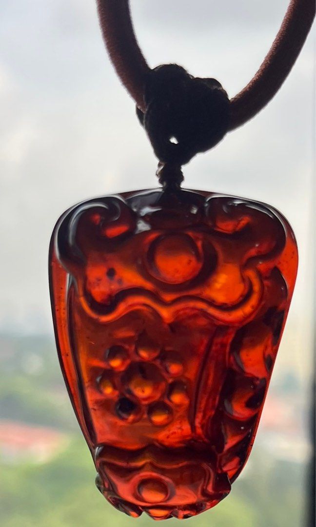 Carved sales amber pendant