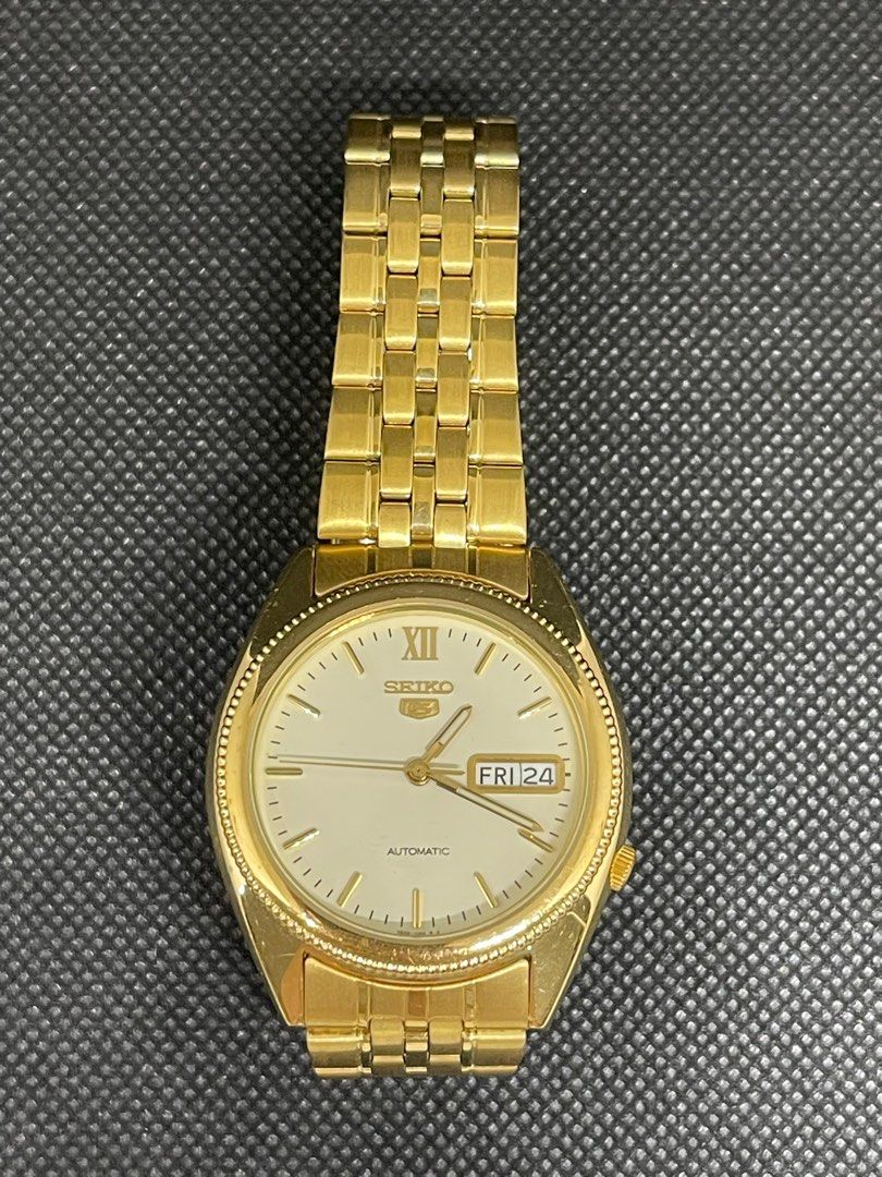 Authentic Seiko Watch Series 5 Automatic Unisex (Category: Men's Watches) located in Mandaluyong City. Submitted by abbottworks (Listing ID 1252700366, Image 2). Description: Authentic. Movement: Automatic Case Width: 38 mm Water Resistance: 30 m (100 feet) Features: Date The Seiko Series 5 men’s automatic watch is a stylish and sophisticated timepiece. The round stainless steel case is gold PVD-plated, 38 mm in size, and has a Hardlex crystal. I