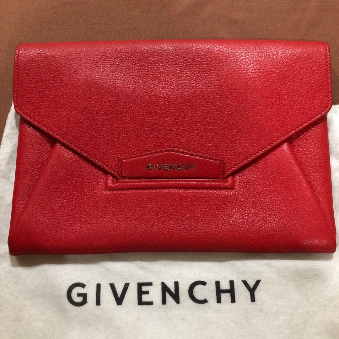 Givenchy Antigona Envelope Clutch Red (Category: Luxury Bags & Wallets) located in Quezon City. Submitted by kateykate12345 (Listing ID 1252708296, Image 1). Description: Only comes with clutch and dustbag. I cannot find the serial but I bought this from a reputable seller saying it is authentic and may be a display piece. Details align to the authentic one, pls see for yourself. I can process Entrupy also but pls be the one to shoulder the cost.