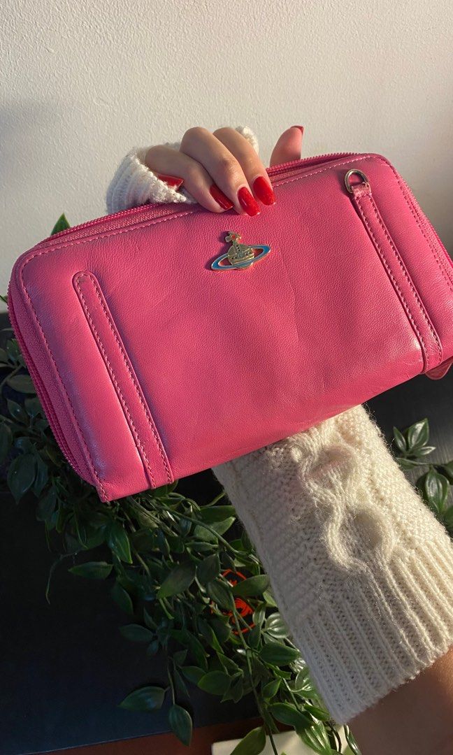 VIVIENNE WESTWOOD WALLET (Category: Luxury Bags & Wallets) located in Cavite. Submitted by lily_anik (Listing ID 1252674283, Image 1). Description: !! not sure if authentic !! never used this wallet but since there’s many signs of usage, i’m letting it go. (it came with a bag i bought from an IG shop) Please DM for more pics (preferably before you offer).