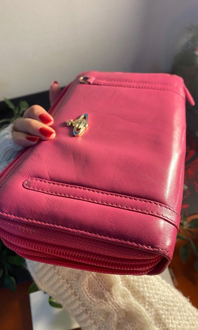 VIVIENNE WESTWOOD WALLET (Category: Luxury Bags & Wallets) located in Cavite. Submitted by lily_anik (Listing ID 1252674283, Image 2). Description: !! not sure if authentic !! never used this wallet but since there’s many signs of usage, i’m letting it go. (it came with a bag i bought from an IG shop) Please DM for more pics (preferably before you offer).