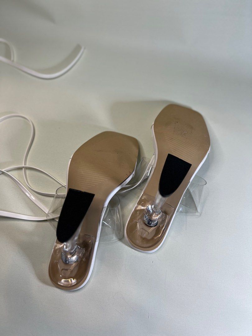 White Tie Leg Heeled Thong Sandals (Category: Heels) located in Paranaque City. Submitted by donnavlrn_ (Listing ID 1252785395, Image 3). Description: Color: White Type: Thong Sandals Heels: Sculptural Heels Heel Height: 10cm / 3.9inch Upper Material: PVC Lining Material: PVC Insole Material: PU Leather Outsole Material: Rubber SKU: sx2112075546476875 Item id: 8349262 Size: EU 36 / UK3 / US 5 New/never been worn outside the house Bought these for