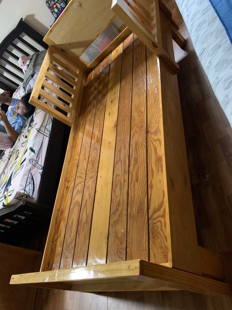 Wooden Toddler Bed (Category: Children's Beds) located in Manila. Submitted by ampmd (Listing ID 1252608624, Image 2). Description: 30in X 60in Toddler Bed. Very heavy and sturdy. Customized bed. Made from good lumber pine wood. With two drawers. Fixed price but comes with free foam. .