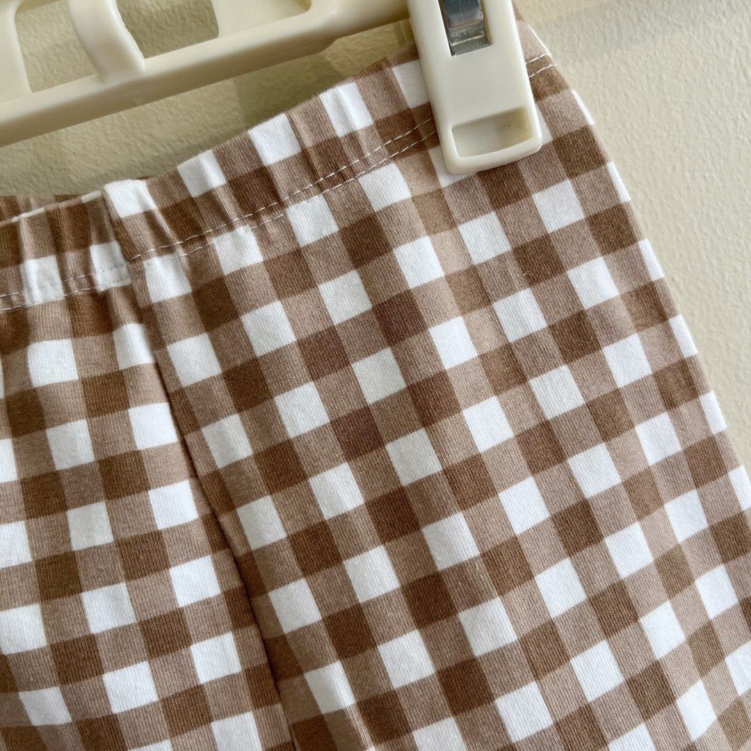 Brown gingham leggings (Category: Babies & Kids Fashion) located in Pasig City. Submitted by sagefields (Listing ID 1257556227, Image 2). Description: Thick fabric 8" waist but can fit up to 9" comfortably.