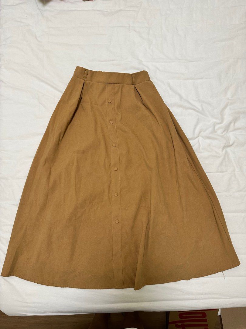 Brown Skirt (Category: Skirts) located in Pasig City. Submitted by DeclutterMommaKim (Listing ID 1257509258, Image 1). Description: used once.