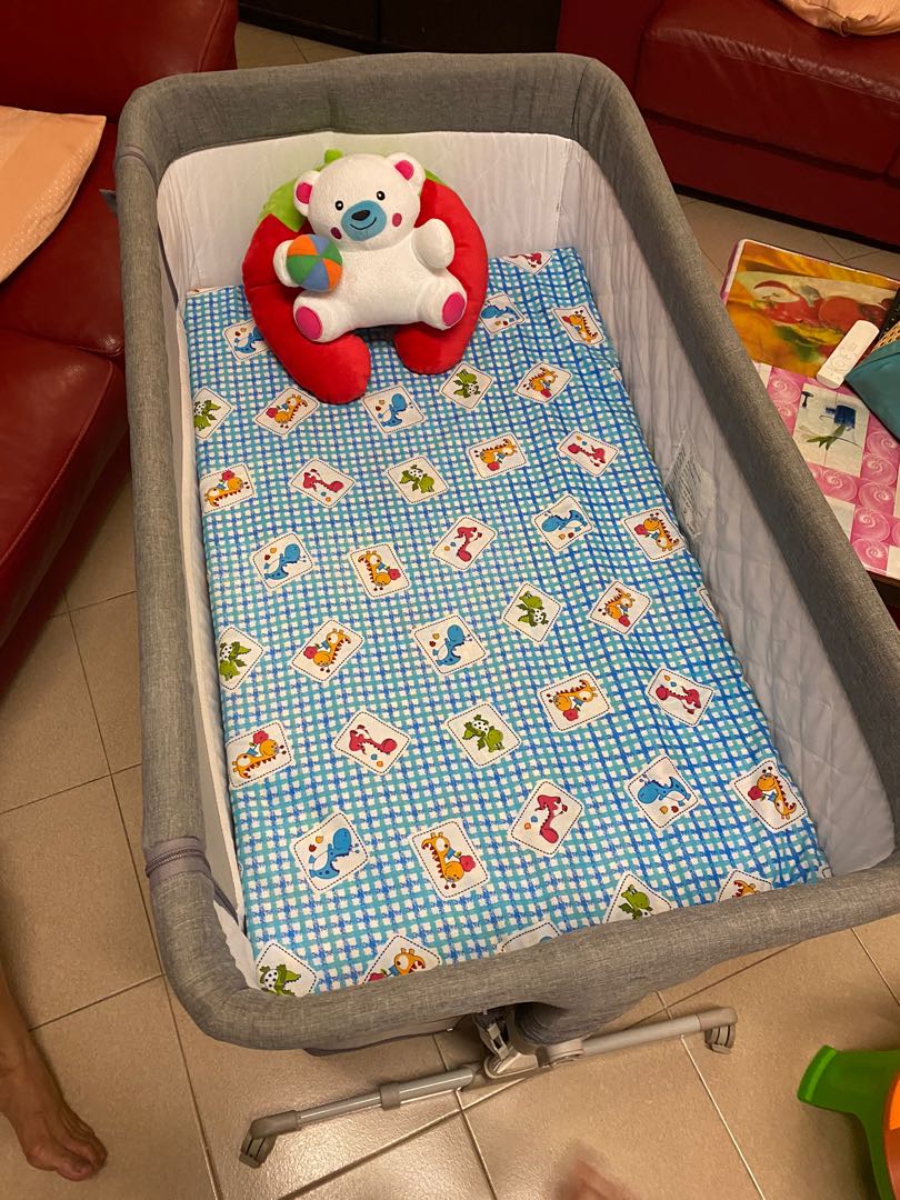Good condition baby cot adjustable height mattress only use once