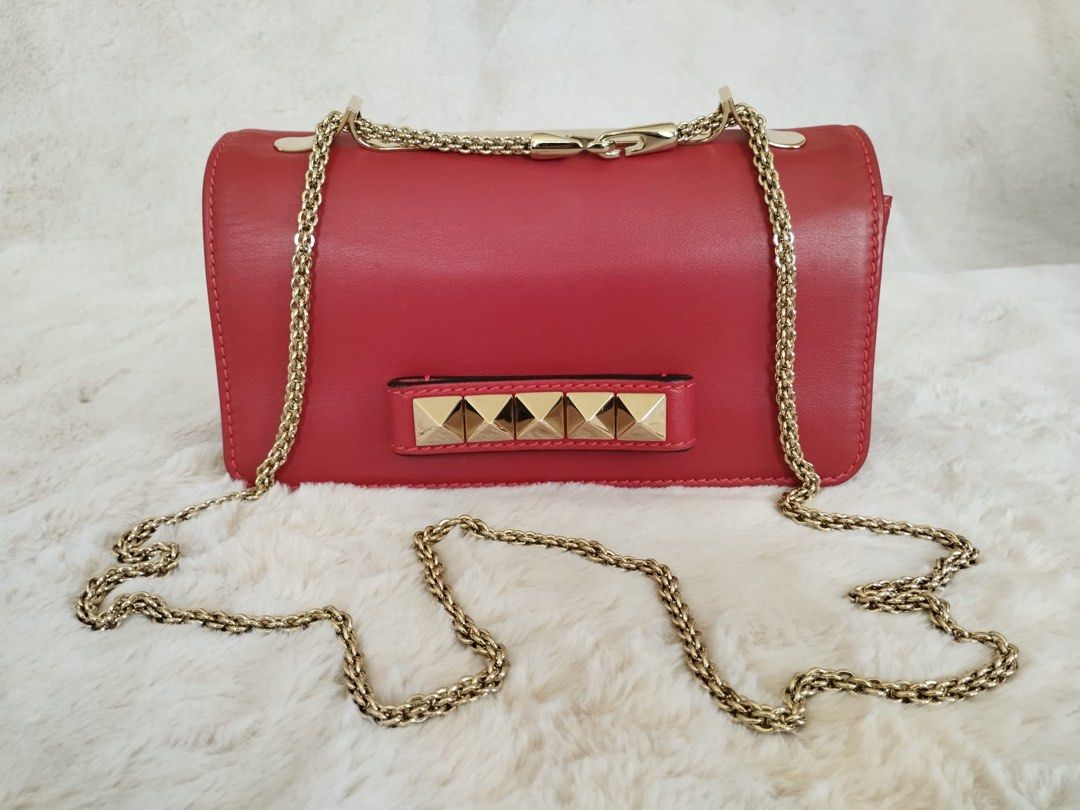 Gold valentino clutch bag on sale