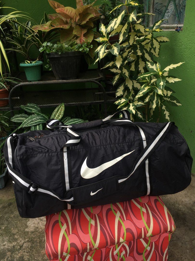 Vintage Nike Duffle Bag (95L) (Category: Sling Bags) located in Iriga City. Submitted by blimpshady (Listing ID 1257519129, Image 3). Description: Vintage 90's Nike Duffle Bag (95 L) L 28.5" / W 14" / H 14" approx. Very good condition Honest issue: Crack prints .