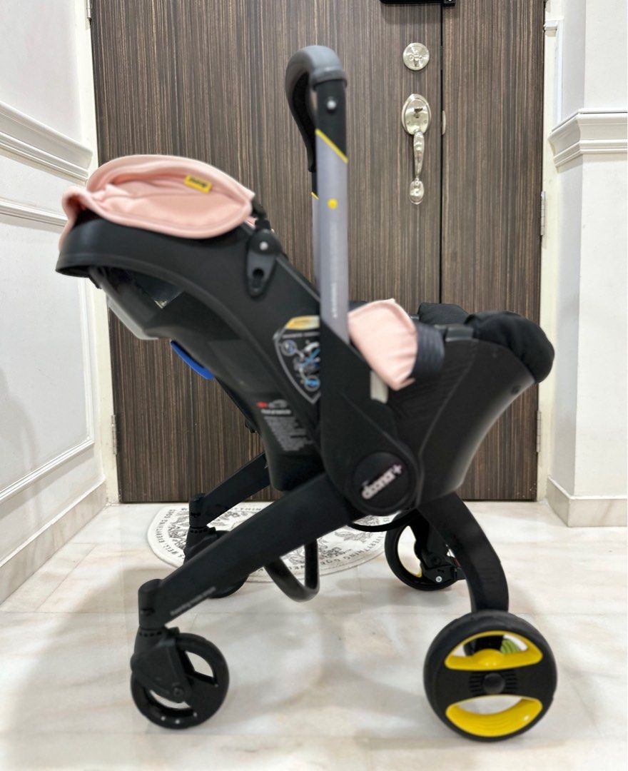 Siège auto et poussette Doona en un: Blush Pink