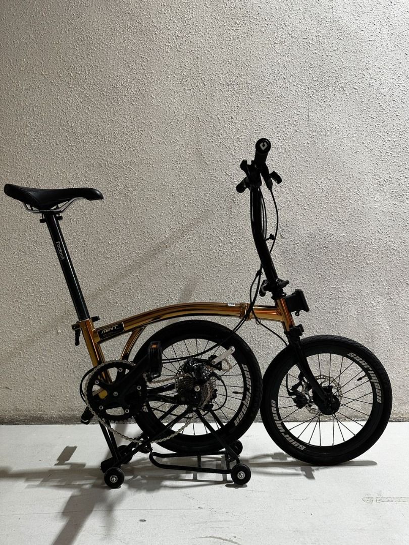 Mint Trifold 9S 16" Disc Brake Foldable Bike Folding Bicycle 9 Speed same as SUNRIMOON rose gold M bar (Category: Bicycles) located in Singapore. Submitted by passionliving (Listing ID 1252895868, Image 2). Description: SLIGHT scratches on the FRAME Frame material: Chromoly steel Groupset: Premium Taiwan LTWOO External 9 speed R5 shifter/rear derailleur Wheelset: 7o'clock 349 16" (4 bearing hub) Front 100mm Rear 135mm O.C.D: Front-100mm/Rear-135m