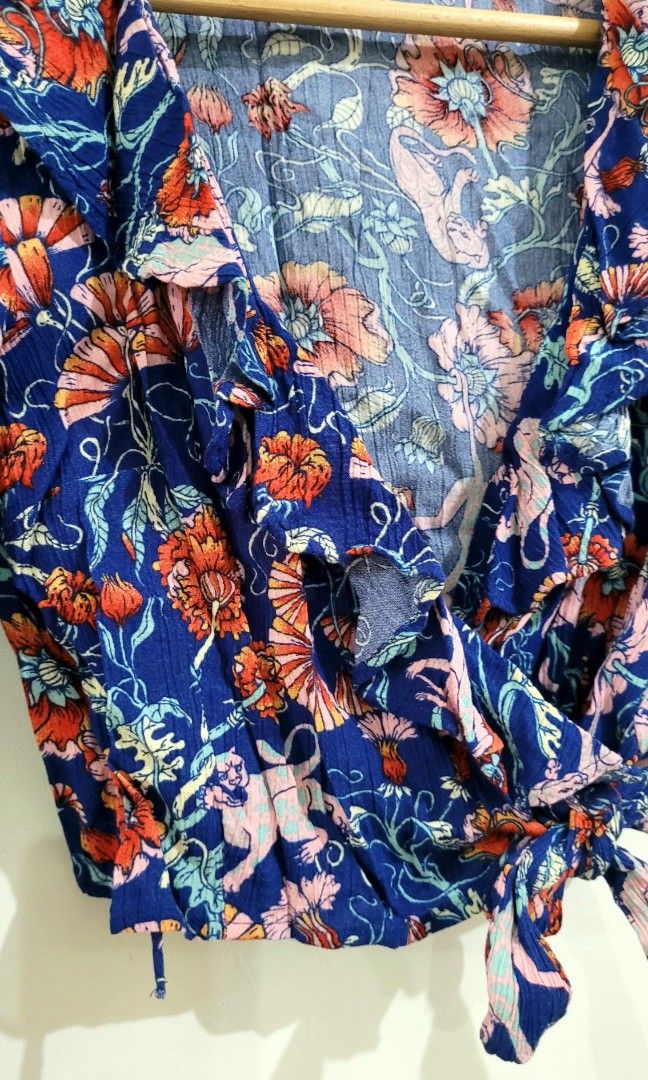 Monki Wrap Blouse (Category: Others Tops) located in Davao. Submitted by NearlyNew (Listing ID 1252807478, Image 3). Description: Size: fits small to medium No when worn pics please 😉 Payment thru GCash J&T Express Shipping Fee: 100 pesos Ships on Saturday only.