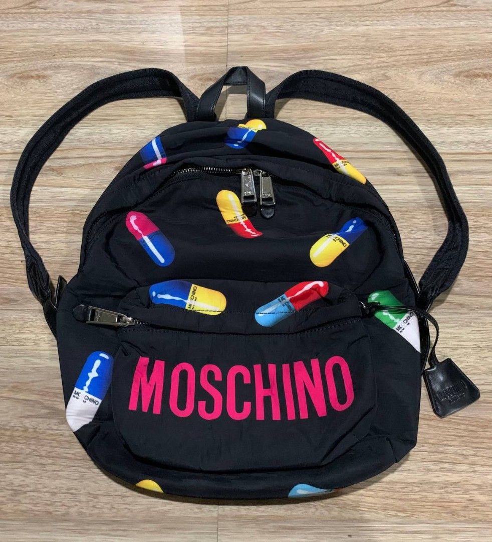 Moschino pill print backpack, Men's Fashion, Bags, Backpacks on Carousell