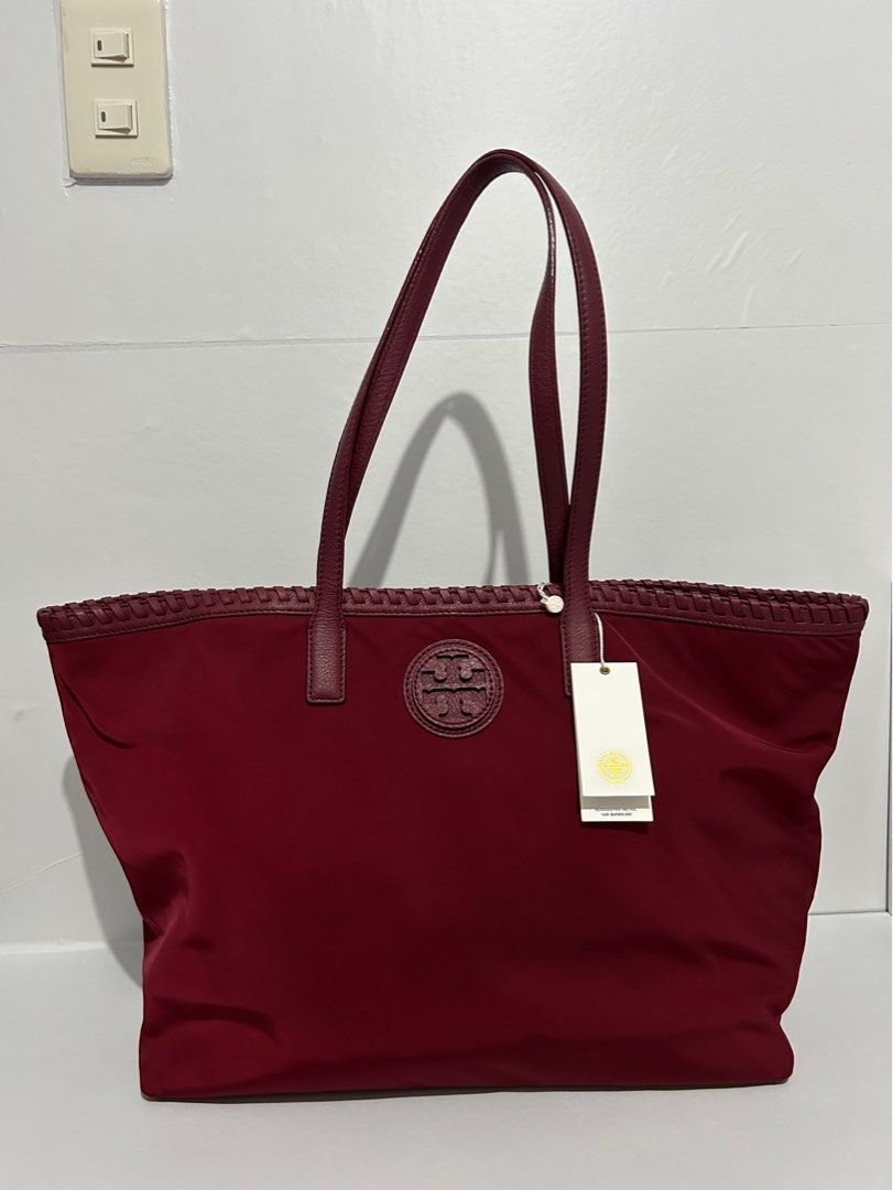 Tory Burch Maroon Marion Nylon Large Tote Bag (Category: Luxury Bags & Wallets) located in Dinalupihan. Submitted by w_finds (Listing ID 1252865320, Image 2). Description: ❗SHIPPING FEE NOT INCLUDED TO THE PRICE. ✅ STILL NEGOTIABLE (NOT TOO LOW) ✅ WHAT YOU SEE WHAT YOU GET ✅ MOP: COP, GCASH, BANK TRANSFER. ✅ COURIER: LBC, JNT, JR EXPRESS,LALAMOVE ✅ NO RETURN WITHOUT VIDEO PROOF ✅ALL FLAWS WHERE SEEN ON THE PICTURE (IF ANY) ❌ NO TO JOYJOY BUYER/RE