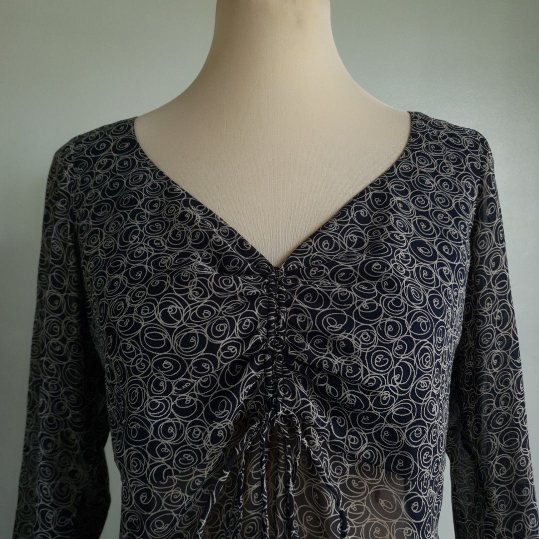 WESTECS Printed Sheer Blouse (Category: Blouses) located in San Pedro. Submitted by open_stash (Listing ID 1252846111, Image 1). Description: WESTECS Printed Sheer Blouse W 50 cm x L 68 cm Tagsize L Semi-sheer fabric but double lined across the chest area.