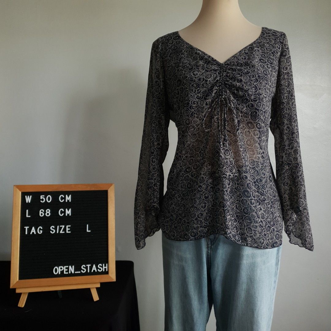 WESTECS Printed Sheer Blouse (Category: Blouses) located in San Pedro. Submitted by open_stash (Listing ID 1252846111, Image 2). Description: WESTECS Printed Sheer Blouse W 50 cm x L 68 cm Tagsize L Semi-sheer fabric but double lined across the chest area.