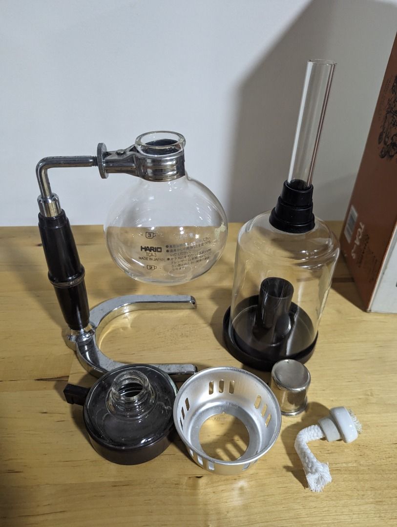 Hario Coffee Syphon TCA-3 (Category: Coffee & Tea Tableware) located in Paranaque City. Submitted by bluecatnip (Listing ID 1253048998, Image 2). Description: Hario Coffee Syphon TCA-3 - with minor surface defects on handle - glassware and cover in good condition, no damage - metal spring, filter, and cloth not included Buyer shoulders courier fee.