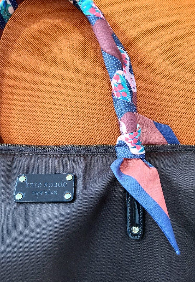 Kate Spade laptop bag dark brown (Category: Luxury Bags & Wallets) located in Manila. Submitted by annemae0710 (Listing ID 1233768918, Image 2). Description: signs of usage on top handle which are addressed by the twilly. 🙂 well used but still in good condition. just have to let go as i bought a new laptop bag. shoulder handle got lost but can give the one i'm using for it..