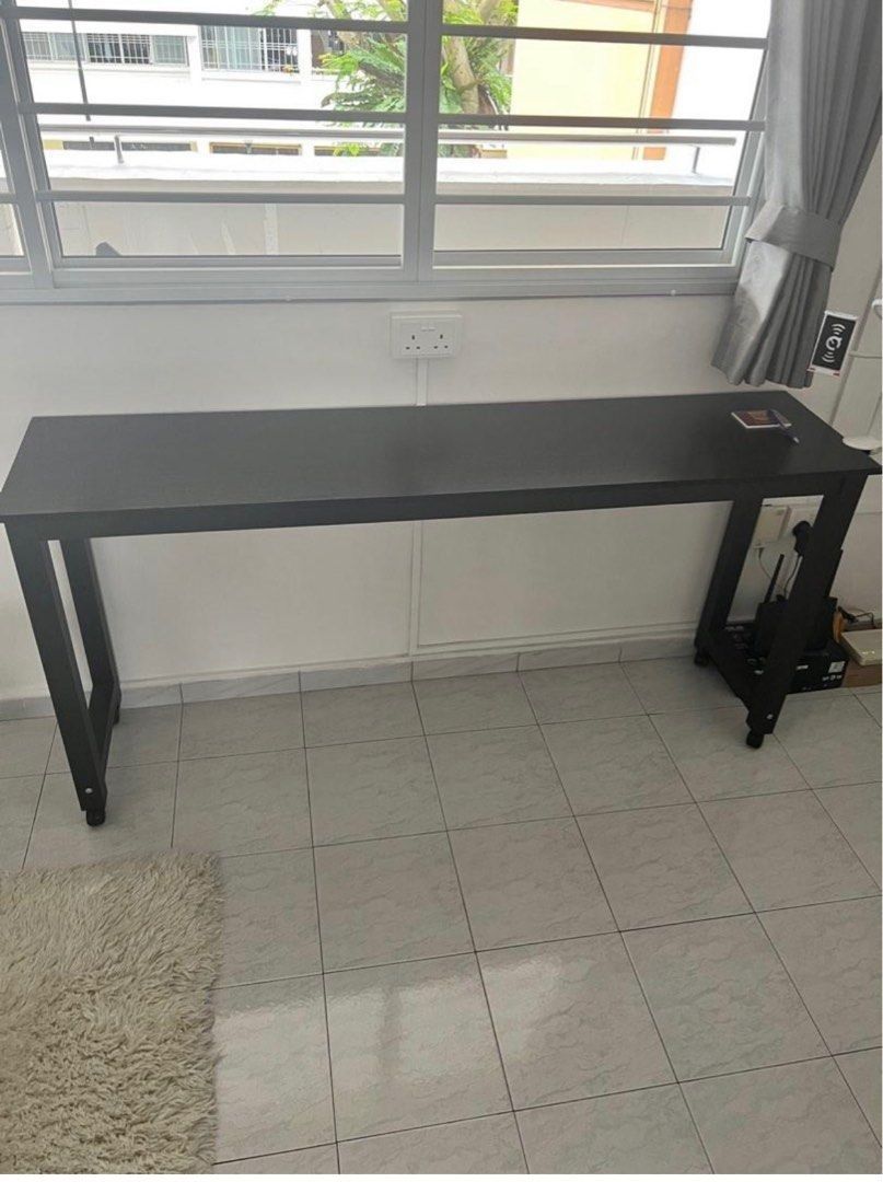 Moveable Study/ Work Table (Category: Tables & Sets) located in Singapore. Submitted by juniro (Listing ID 1253045661, Image 2). Description: 1. It can used as a Bed Table (Reference to Photo 1) 2. Can be used as a Work Desk (Reference to Photo 2) 3. Comes with rollers at the bottom and easy to move around Dimension: 170 x 40 x 80 Material: Solid Wood Original Price: $250 .