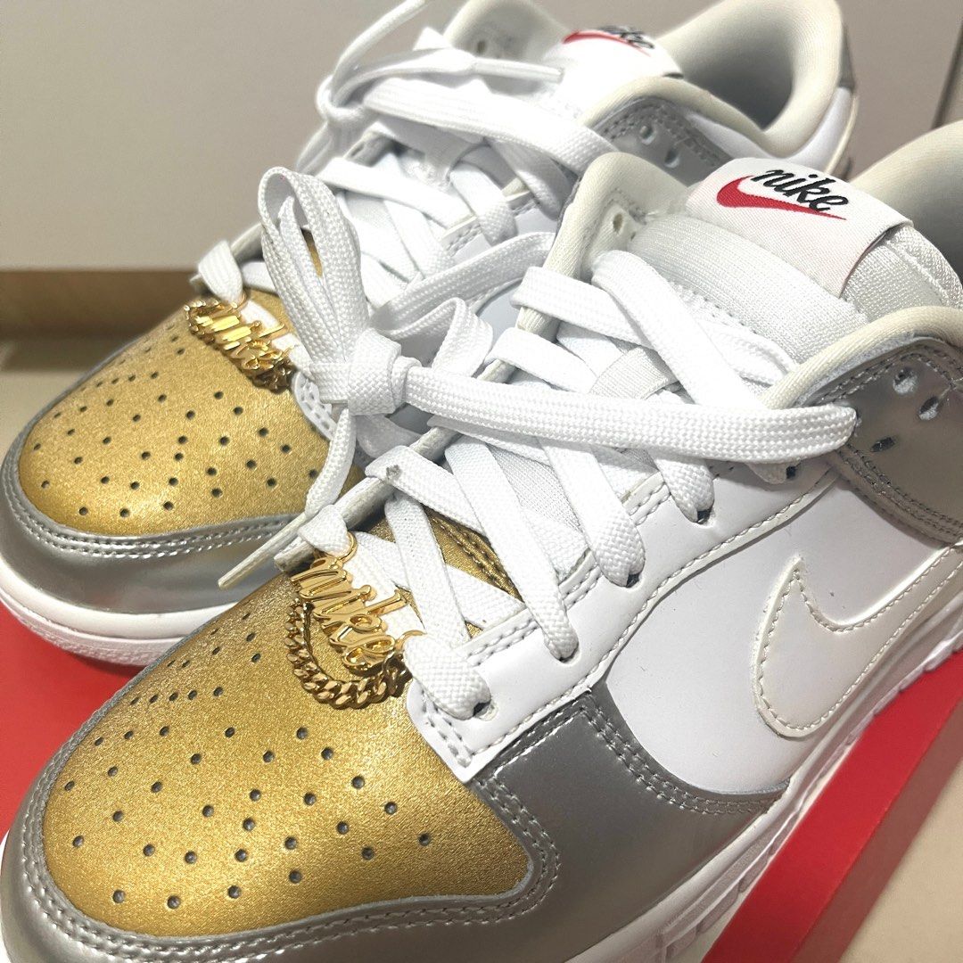 W NIKE DUNK LOW SE GOLD WHITE SILVER Women s Fashion Footwear