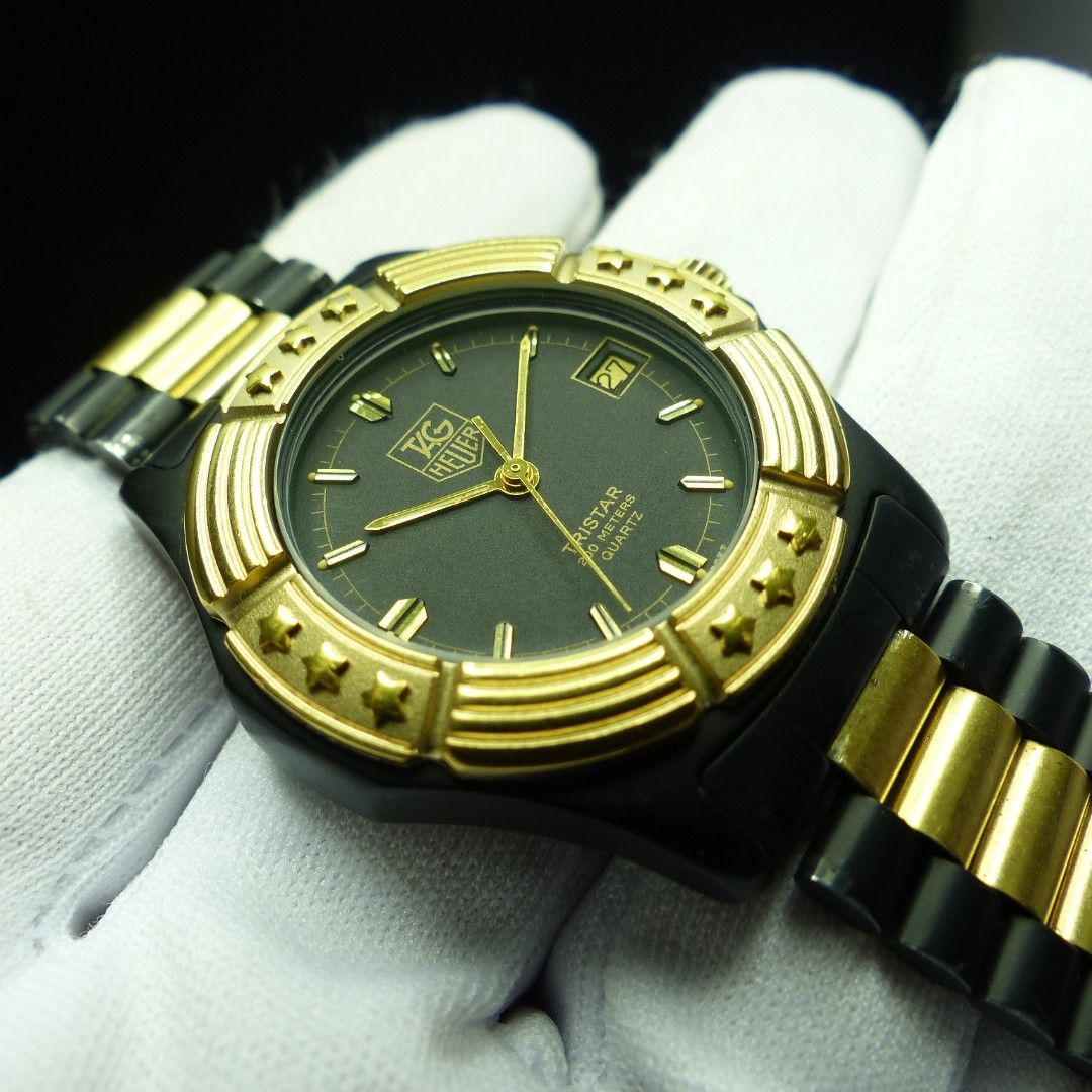 Tag heuer black store and gold watch