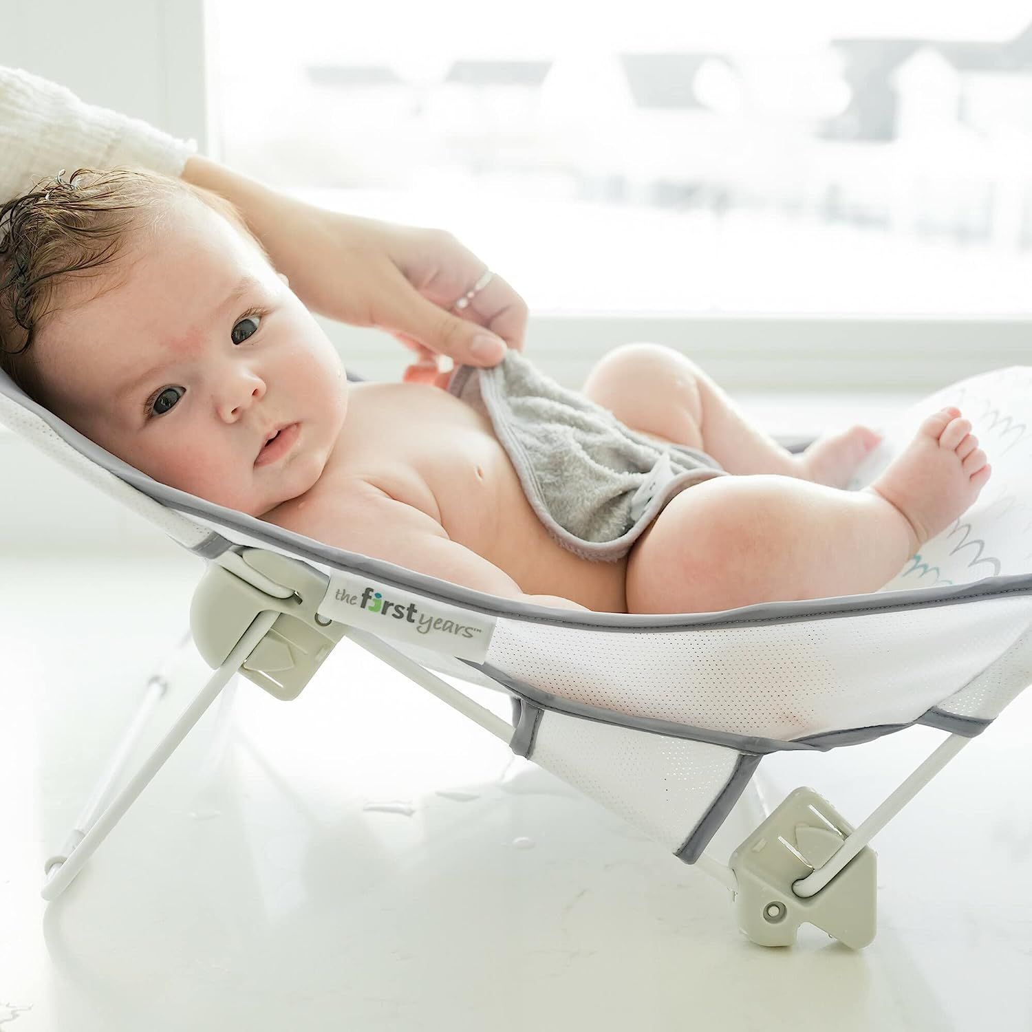 The First Years Sure Comfort Folding Baby Bather Baby to Toddler Bath Tub No Slip Seat for Sink or Tub Use