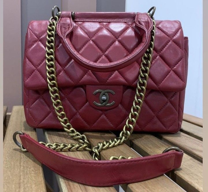 Vintage Chanel Slingbag (Category: Bags & Wallets) located in Kuala Kangsar. Submitted by Hani_Itsar (Listing ID 1171564933, Image 2). Description: Colour : Burgundy/maroon Material: Calf Skin ( Vintage bag) Condition : 9/10 *datecode *design n brand yg sama seperti isteri artis pakai😍..warna je berbeza *nak let go sbb jarang diguna *boleh refer gambar ke 4 Size: Medium Length :28cm Width: 8cm Height: 20cm *tali asal..n berat.. *handcarry/should