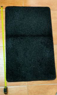 Black with a little bit of greyish carpet 49cmx78cm