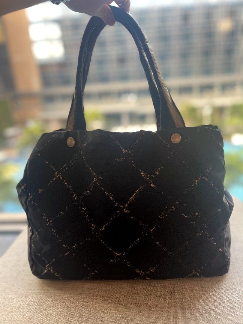 Chanel Nylon CC Old Travel Line (Category: Luxury Bags & Wallets) located in Antipolo. Submitted by msshop26 (Listing ID 1253471723, Image 3). Description: Grab this Chanel Nylon for a very low price Chanel Black Nylon Quilted By the Sea Print Tote Bag CC Old Model Travel Line Tote Bag Light Weight Chanel Bag Good for everyday errands 8/10 signs of used still holo intact.