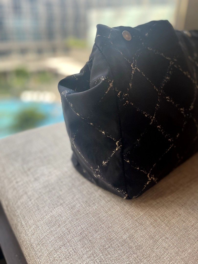 Chanel Nylon CC Old Travel Line (Category: Luxury Bags & Wallets) located in Antipolo. Submitted by msshop26 (Listing ID 1253471723, Image 2). Description: Grab this Chanel Nylon for a very low price Chanel Black Nylon Quilted By the Sea Print Tote Bag CC Old Model Travel Line Tote Bag Light Weight Chanel Bag Good for everyday errands 8/10 signs of used still holo intact.
