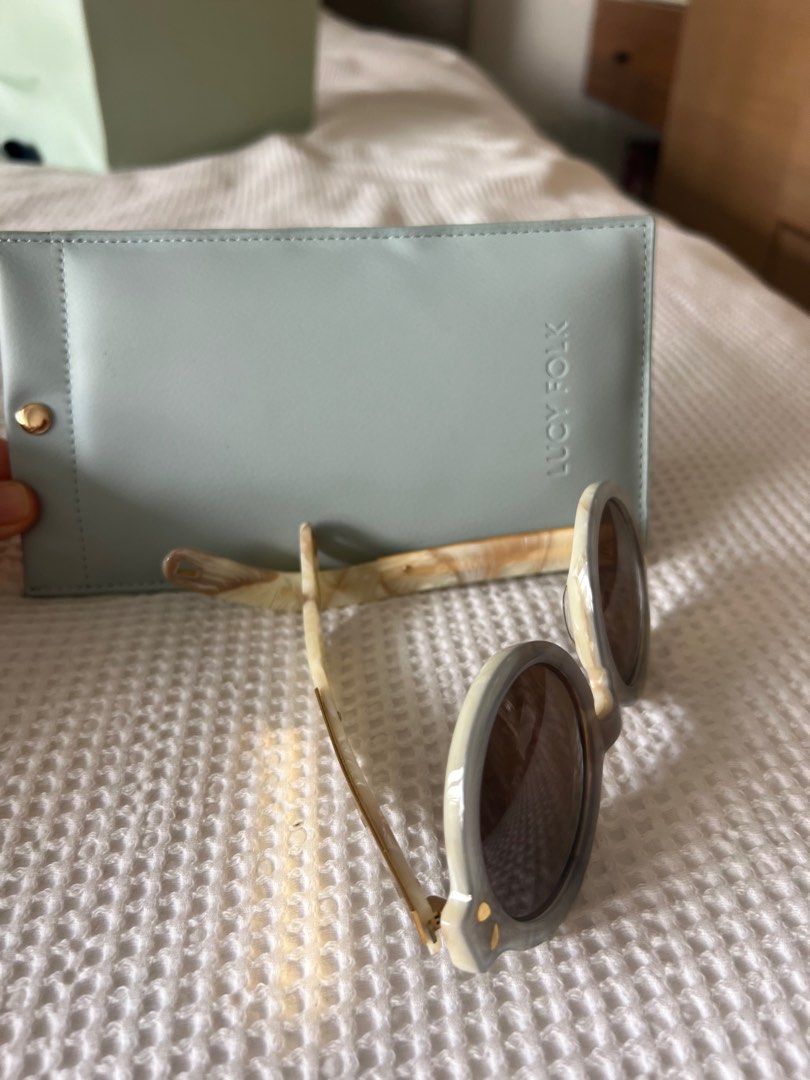 Lucy folk round the world sunglasses store