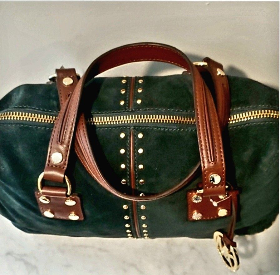 Authentic Michael Kors Huntergreen Weekender Bag (Category: Luxury Bags & Wallets) located in Paranaque City. Submitted by ladybogart (Listing ID 1253453212, Image 3). Description: decluttering Pre-loved MK huntergreen weekender bag. / it looks almost new but stored/bought in the US. Suede with brown leather detailing & gold studs..