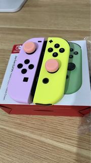 Nintendo Switch joycon pastel purple and yellow