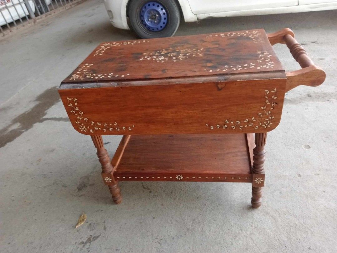 Old Trolley / Foodcart (Category: Other Home Furniture) located in Paranaque City. Submitted by mommykiee (Listing ID 1253412527, Image 2). Description: Old trolley / foodcart Made of narra wood w/ bone inlay Size: When open: L32 W32 H25inch. Closed: L32 W18 H25inch Newly stripped & varnished Ready to use.