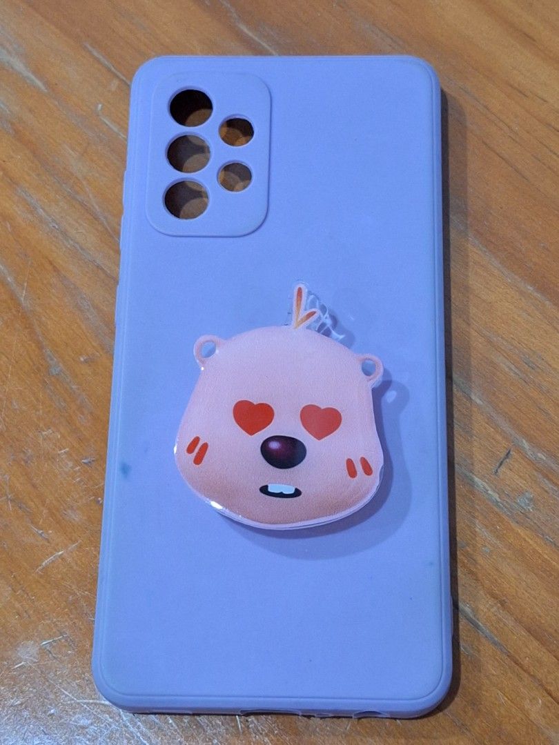 Samsung A52 5G Silocone Phone case (Category: Cases & Sleeves) located in Quezon City. Submitted by kayveee94 (Listing ID 1253407599, Image 2). Description: For Samsung A52 5G silicone phone cases!!! preloved in good condition rfs: changed phone model Purple with Phone grip = P350 Black without Phone grip = P300 For both = P600.