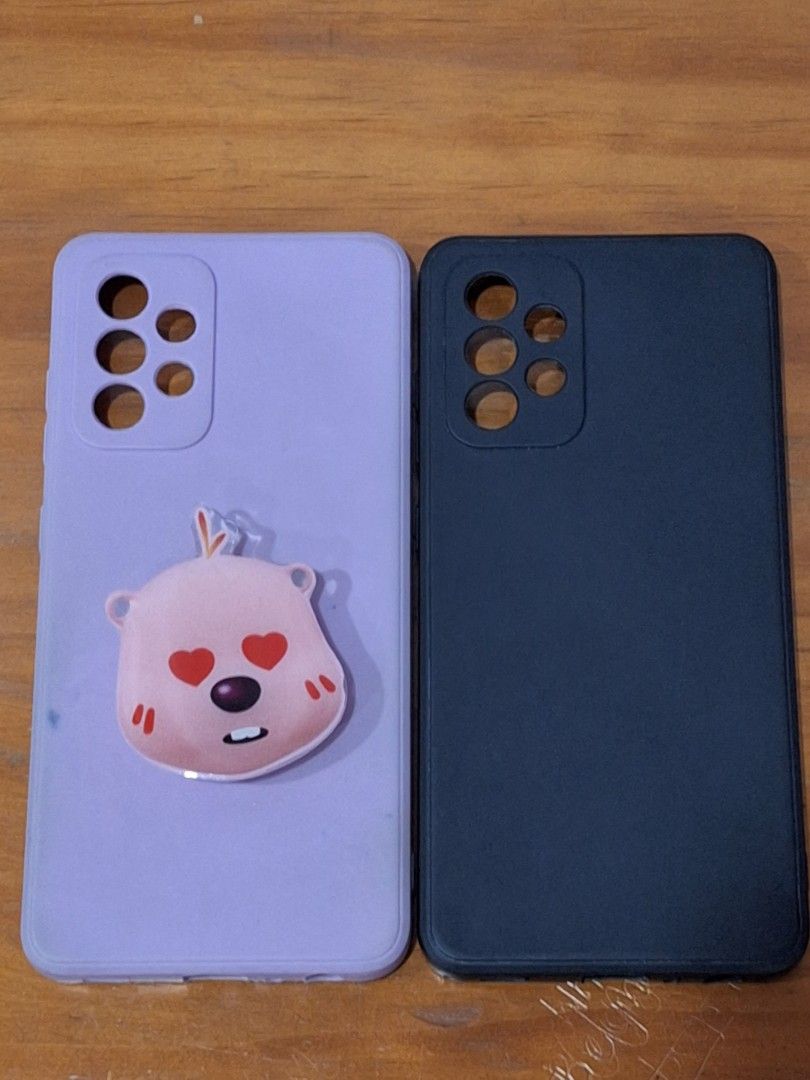Samsung A52 5G Silocone Phone case (Category: Cases & Sleeves) located in Quezon City. Submitted by kayveee94 (Listing ID 1253407599, Image 1). Description: For Samsung A52 5G silicone phone cases!!! preloved in good condition rfs: changed phone model Purple with Phone grip = P350 Black without Phone grip = P300 For both = P600.