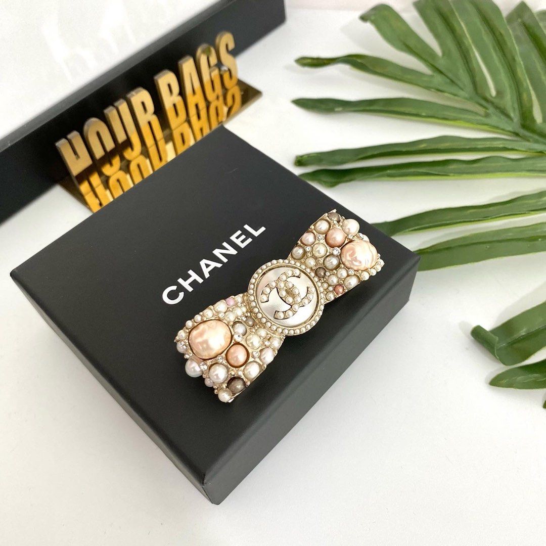 Chanel pearl hotsell brooch price