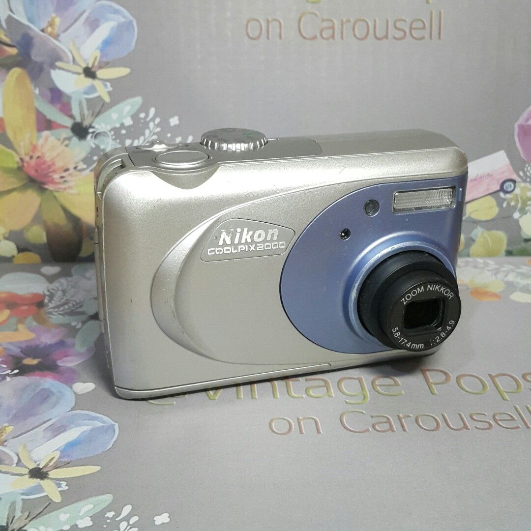 Coolpix 2000 CCD Vintage Vibes Digicam (Category: Cameras) located in Paranaque City. Submitted by vintagepopsicle (Listing ID 1253691182, Image 3). Description: Achieve the look of Old Vintage Vibes photos with this legendary Coolpix 2000 Digicam. ♡ Camera can take photo and video ♡ Photos have a pop or 3D look ♡ Tested including a working flash ♡ Excellent Macro capabilities ♡ The lens cover does not fully close when you turn off because of its