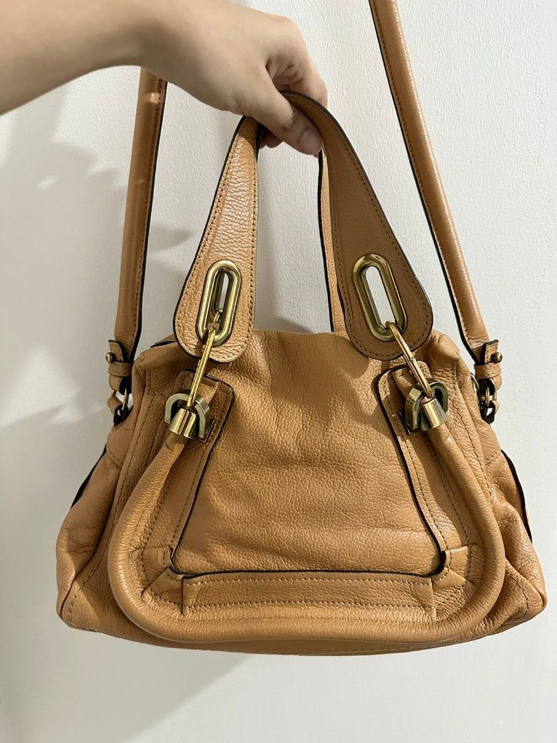 Authentic Chloe Paraty Small (Category: Luxury Bags & Wallets) located in Cainta. Submitted by pastaye (Listing ID 1253738295, Image 2). Description: ** 15.5k for a limited time only!! Preloved Chloe Paraty small Two-way handbag with sling Excellent used condition (no noticeable flaw, no corner rubs, with light marks due to the metal hardware in the strap - see photo) With card and holo is intact RFS: Decluttering (and eyeing a new bag ☺️) MOP: G